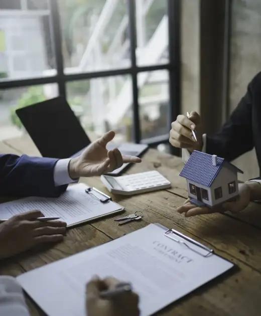 Real estate agent and customer make contract to buy and sell house and land approval of a contract to buy or sell a home offers mortgage loans and home insurance concept.
